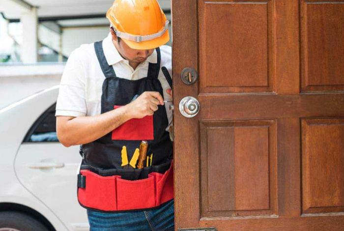 certified locksmith opening a door